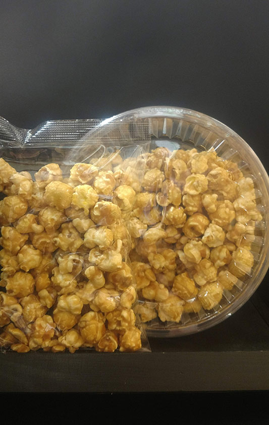 containers of maple popcorn